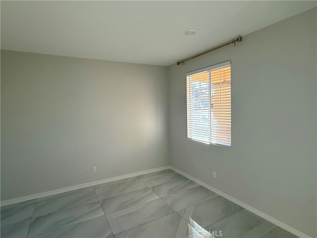 31124 Hanover Lane Menifee, CA 92584 - Photo 7 of 58 a view of an empty room with a window