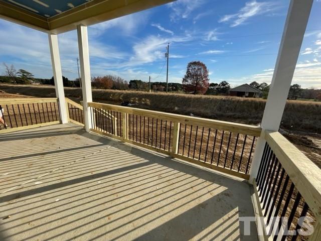 4429 Bridle Run Drive Raleigh, NC 27606 - Photo 7 of 14 a view of a balcony with wooden floor