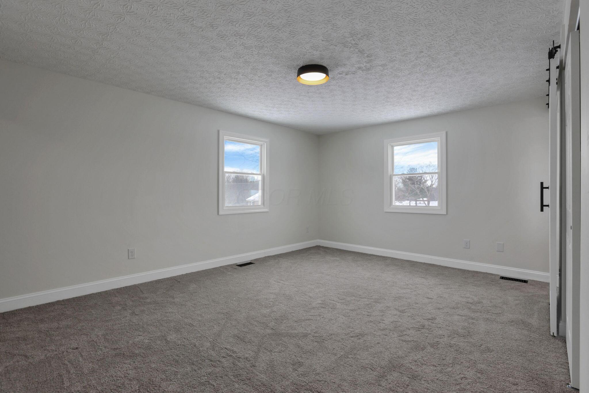 5273 Hayes Road Groveport, OH 43125 - Photo 38 of 89 Primary ensuite bedroom, with new carpeting and plenty of closet space!