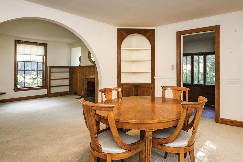 69 Arnold Road Newton, MA 02459 - Photo 5 of 9 a view of a dining room with furniture and a window