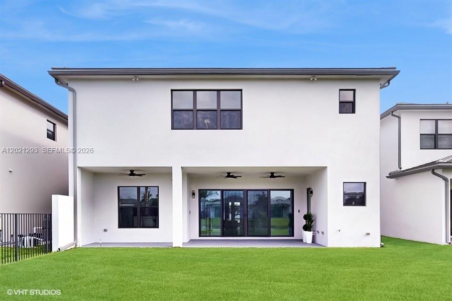 8350 Royal County Down Road Boca Raton, FL 33434 - Photo 34 of 52 a view of a house with a yard