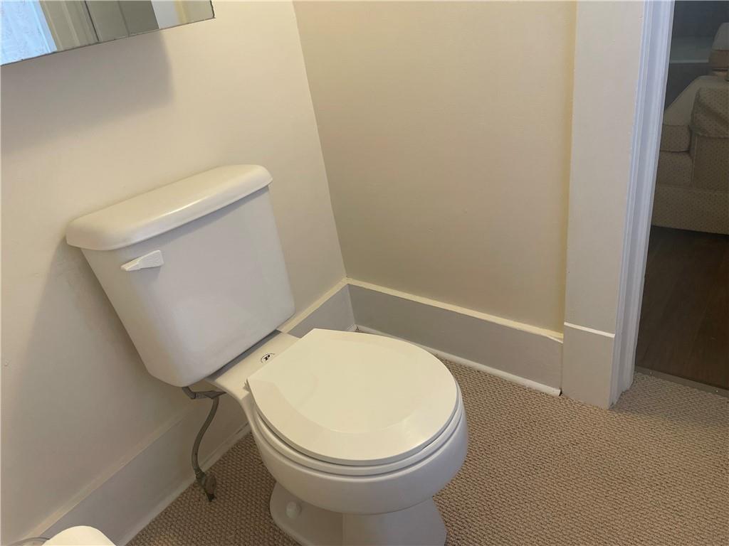 3821-3841 Evergreen Road New Bedford, PA 16143 - Photo 13 of 31 a white toilet sitting next to a shower