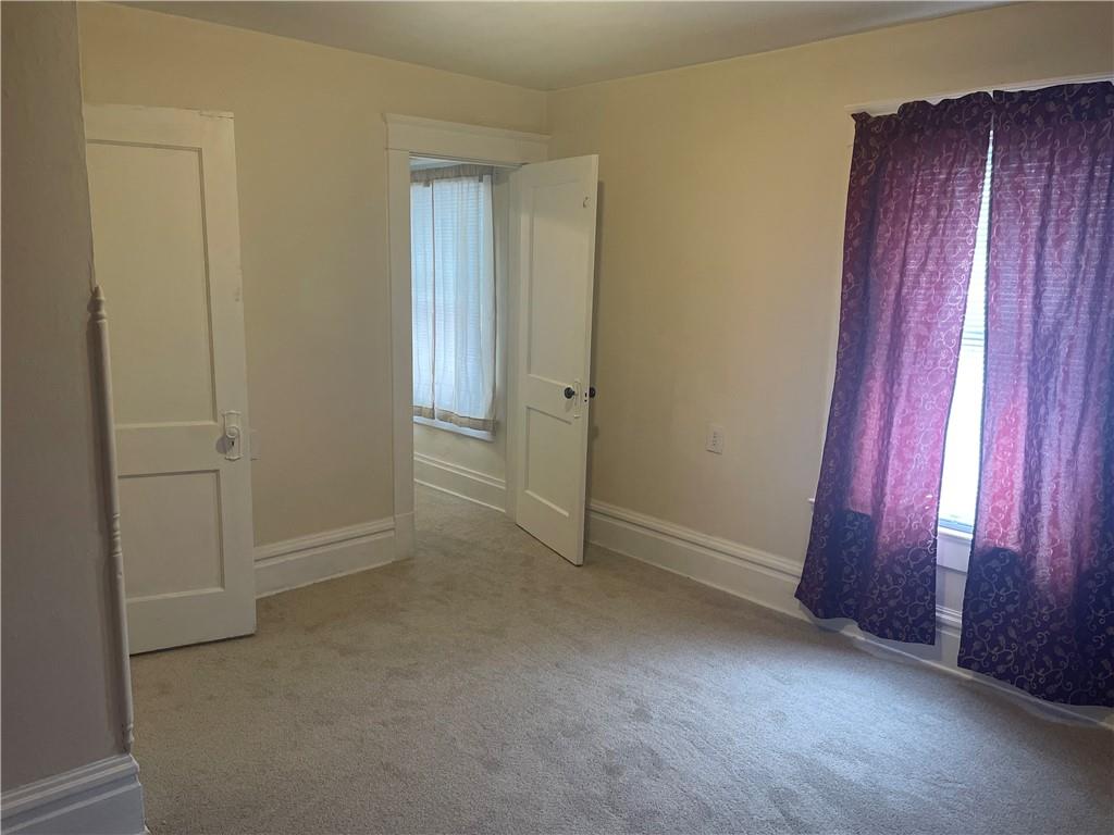 3821-3841 Evergreen Road New Bedford, PA 16143 - Photo 16 of 31 an empty room with windows and closet