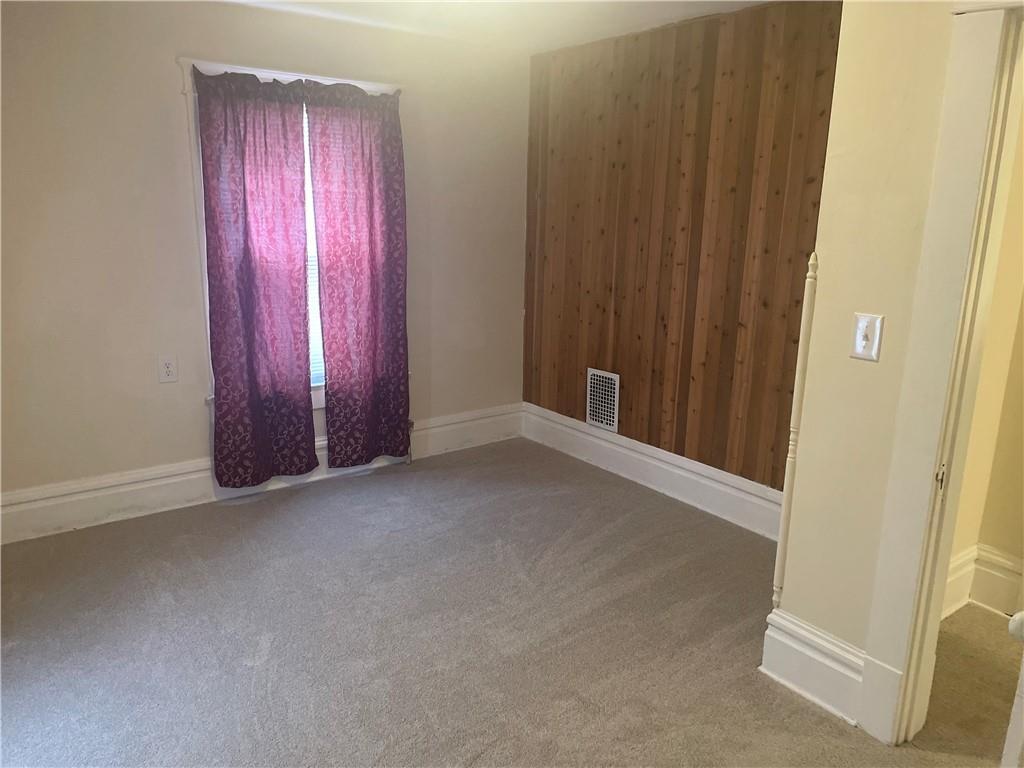 3821-3841 Evergreen Road New Bedford, PA 16143 - Photo 17 of 31 an empty room with windows