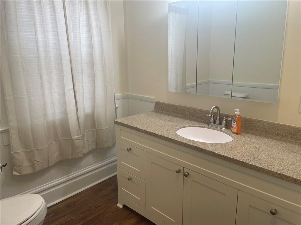 3821-3841 Evergreen Road New Bedford, PA 16143 - Photo 19 of 31 a bathroom with a granite countertop sink and a mirror