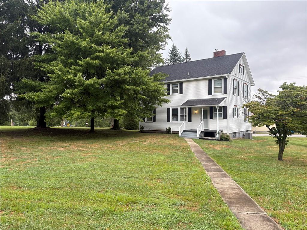 3821-3841 Evergreen Road New Bedford, PA 16143 - Photo 26 of 31 a front view of a house with swimming pool having outdoor seating
