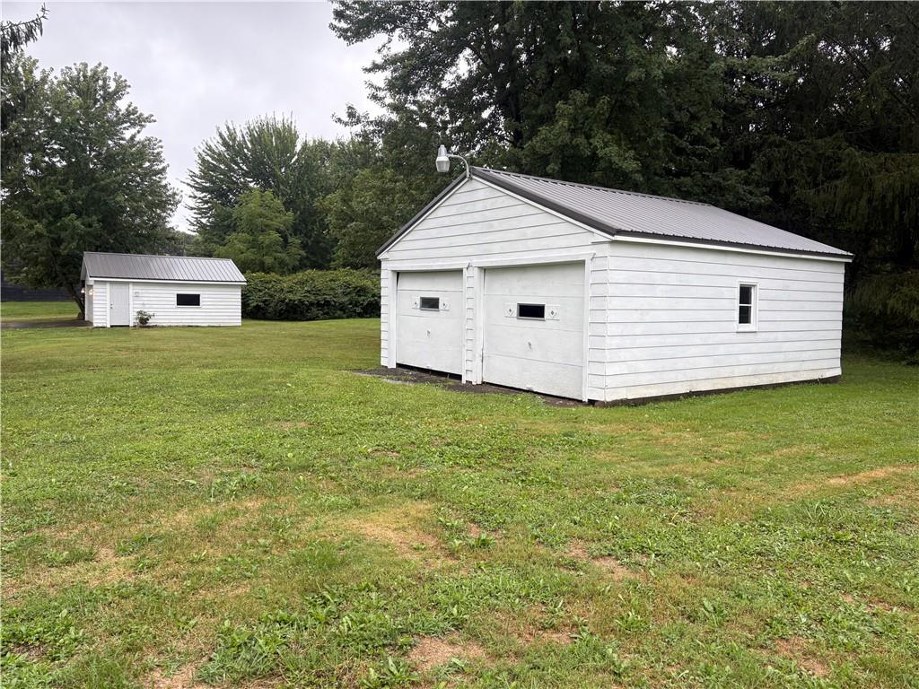 3821-3841 Evergreen Road New Bedford, PA 16143 - Photo 27 of 31 a view of a backyard with a garden