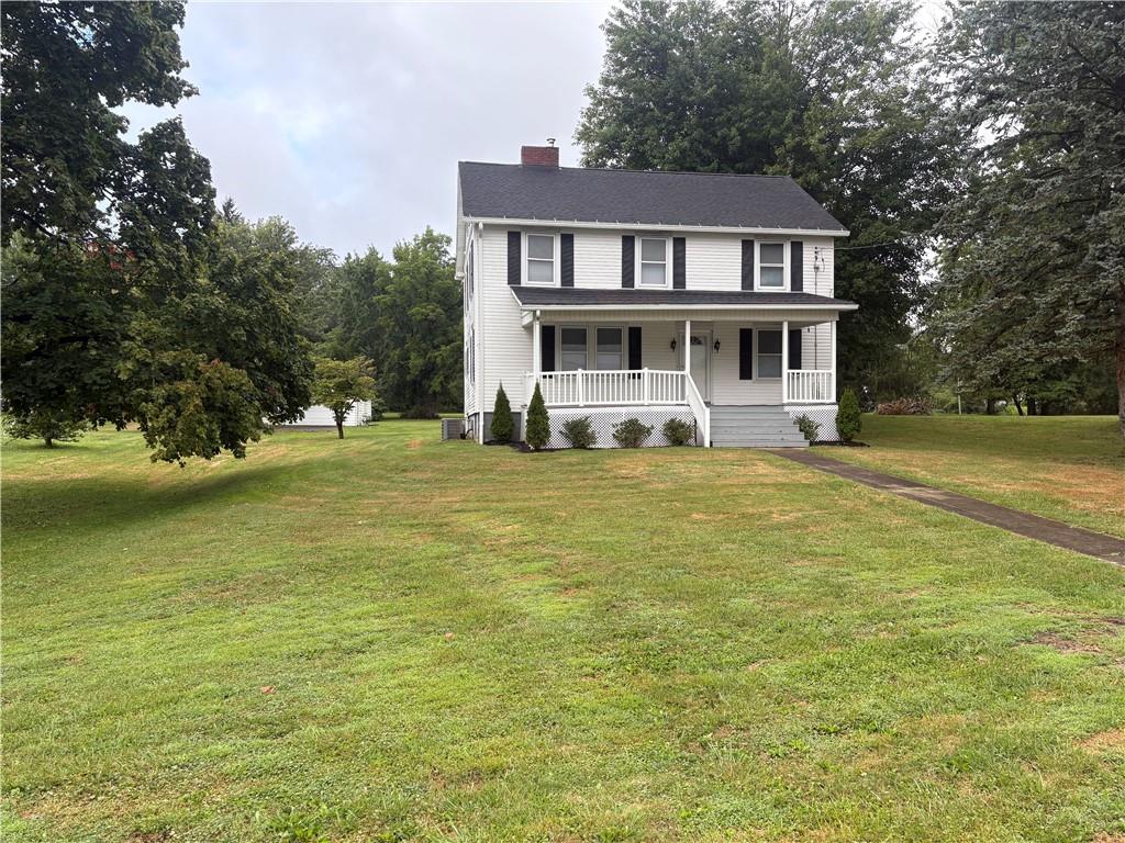 3821-3841 Evergreen Road New Bedford, PA 16143 - Photo 29 of 31 a front view of a house with a yard