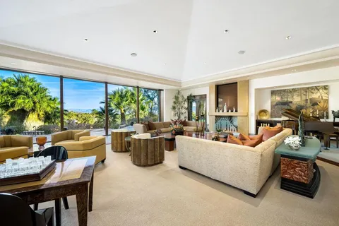 a kitchen with a stove a sink a refrigerator and wooden cabinets