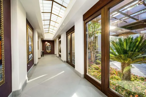 a view of a patio with table and chairs and potted plants