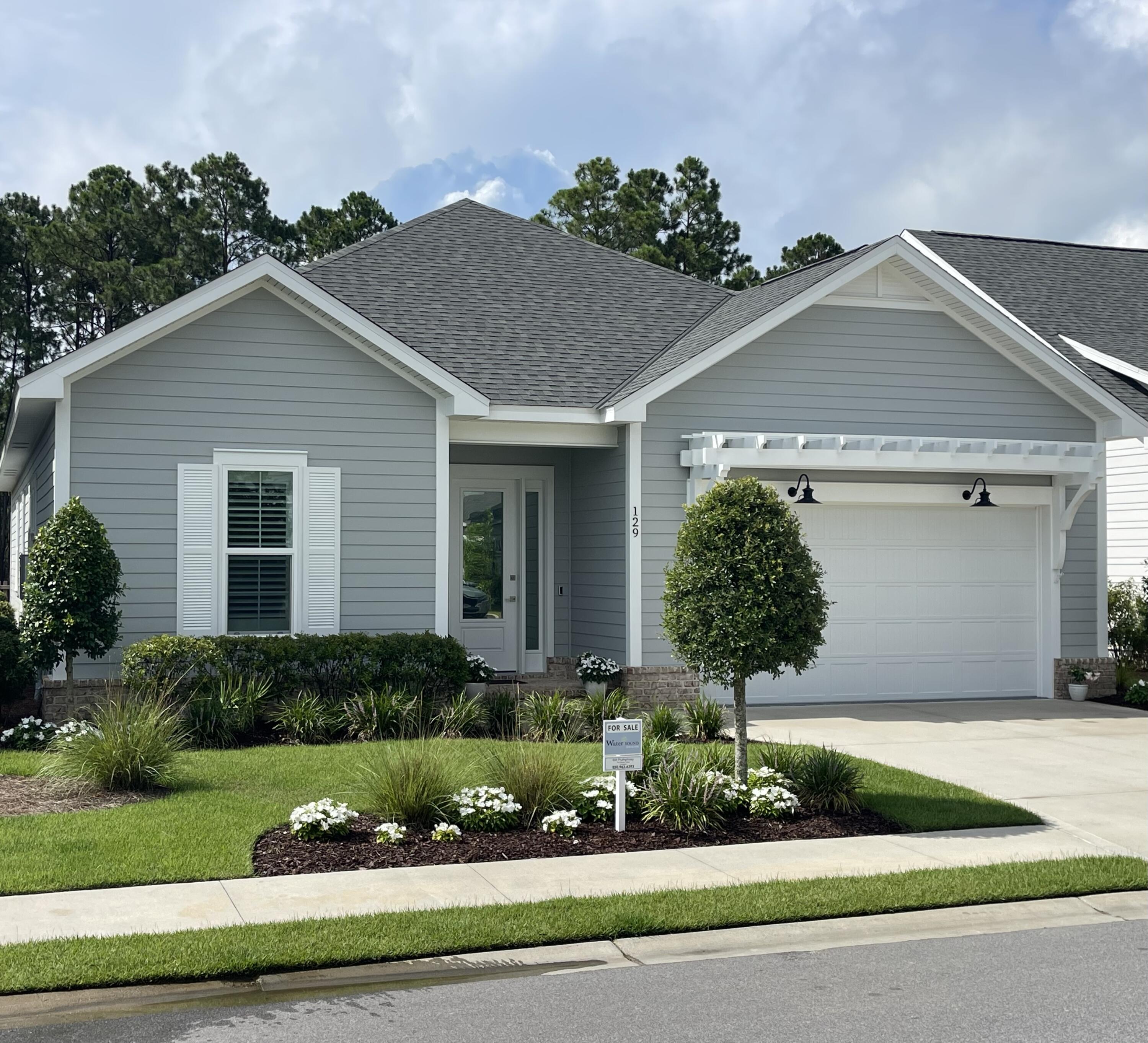 129 Suwannee Dr Inlet Beach Inlet Beach, FL 32461 - Photo 1 of 37 a front view of a house with a yard