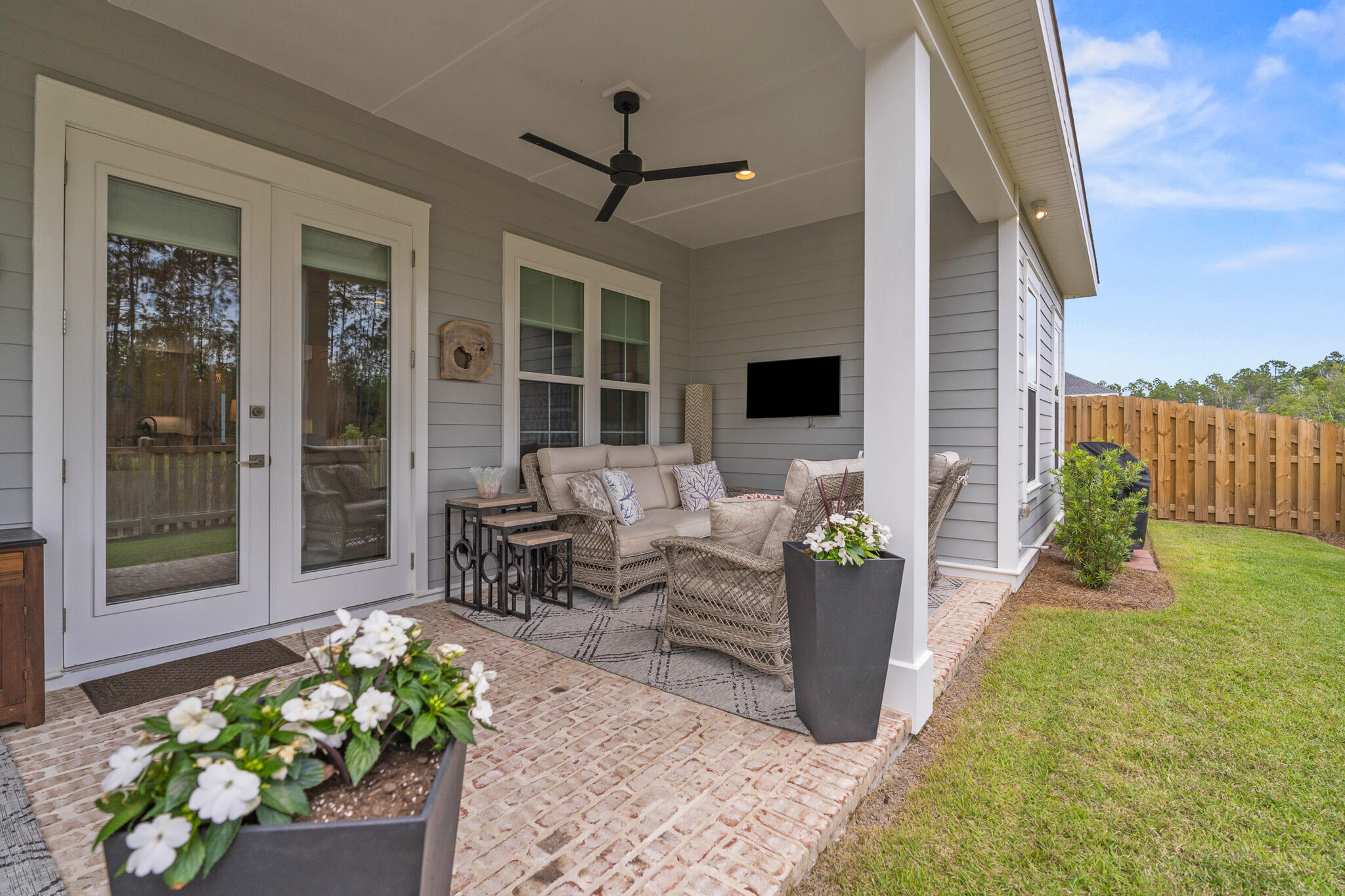129 Suwannee Dr Inlet Beach Inlet Beach, FL 32461 - Photo 24 of 37 a garden with a table and chairs and potted plants