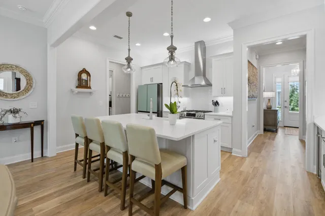 a garden with a table and chairs and potted plants