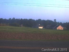 1117 North Ridge Road, Unit 2 Hendersonville, NC 28792 - Photo 1 of 2 a sunset view with a lake