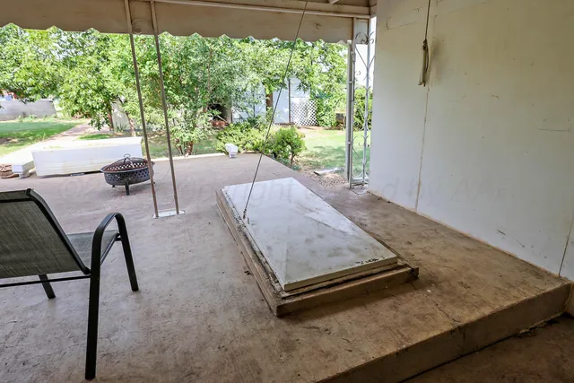 a room with pool table and a floor to ceiling window