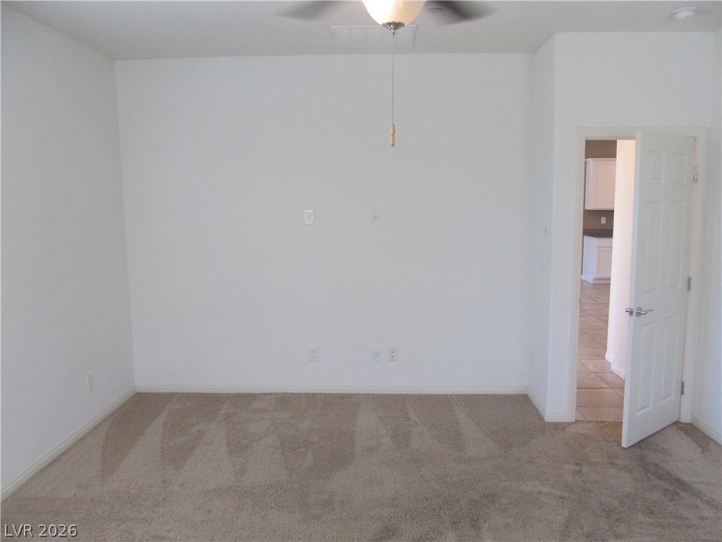 2157 Rio Rancho Pointe Place Henderson, NV 89002 - Photo 11 of 24 A well-proportioned interior space offers a neutral palette and plush carpeting.
