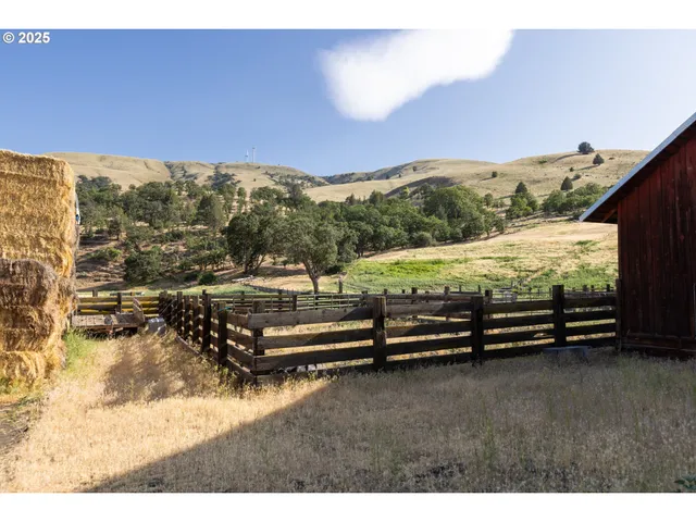 a backyard of a house with lots of green space and mountain view