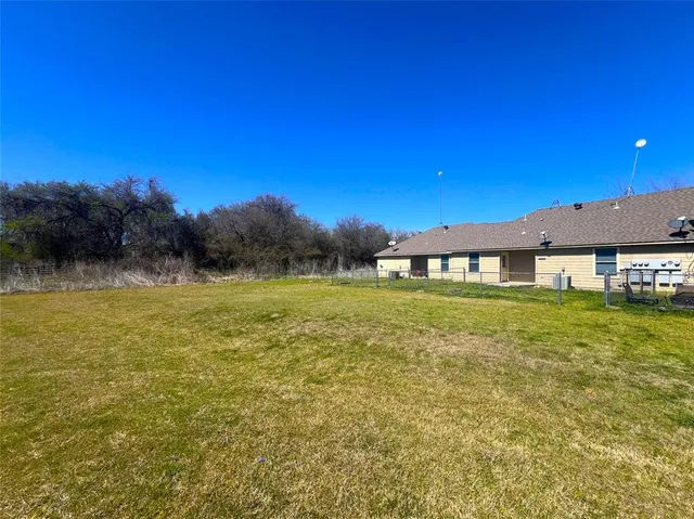 a view of a house with a big yard