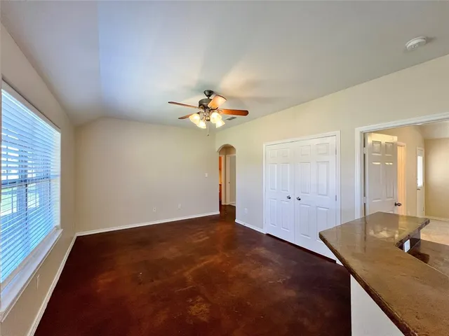 a view of a kitchen with a sink cabinet and a chandelier