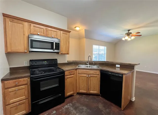 a kitchen with a stove and a microwave