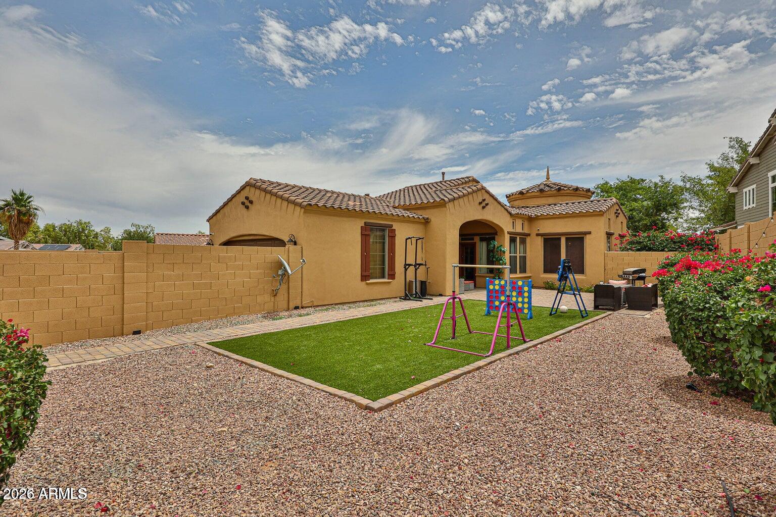 3950 North Edith Way Buckeye, AZ 85396 - Photo 27 of 32 a view of a house with backyard and porch