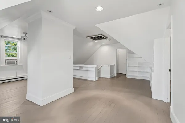 a view of an empty room with stairs