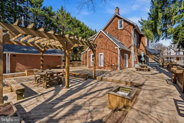 a view of a street with wooden fence