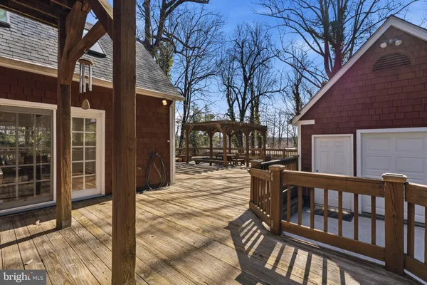 a view of a house with a large tree