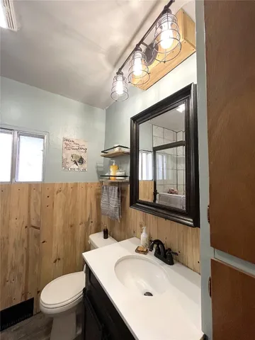 a view of a yard with wooden fence