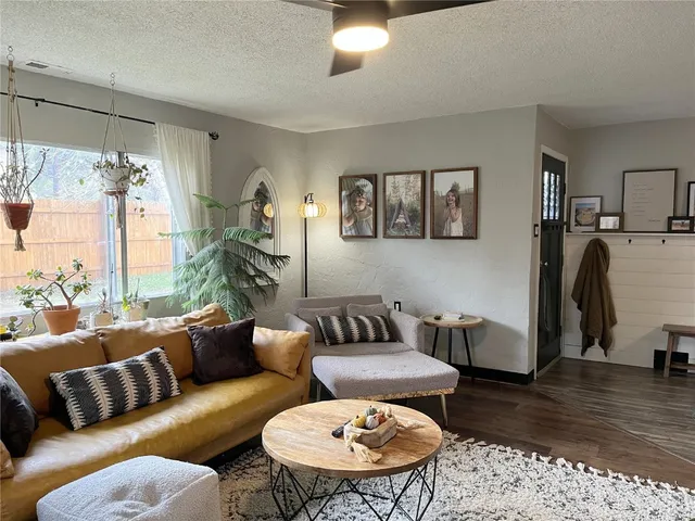 a living room with furniture and a rug