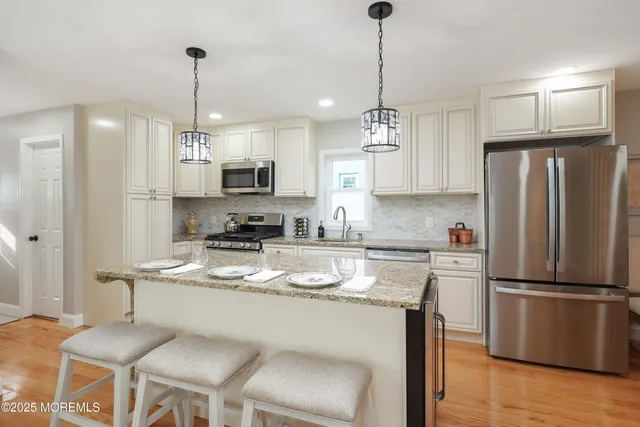 a dining room with wooden floor and breakfast area