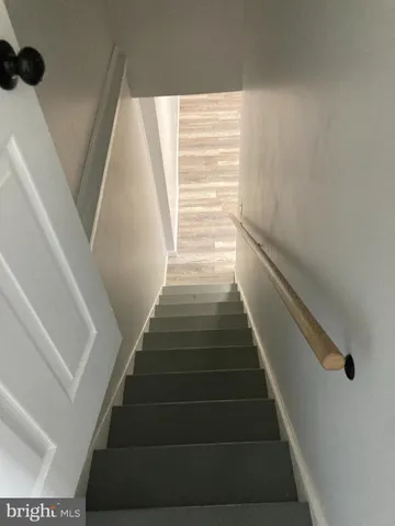 a view of room with wooden floor