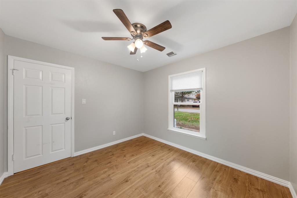 753 Cullum Avenue Hurst, TX 76053 - Photo 19 of 26 a view of a big room with wooden floor and windows