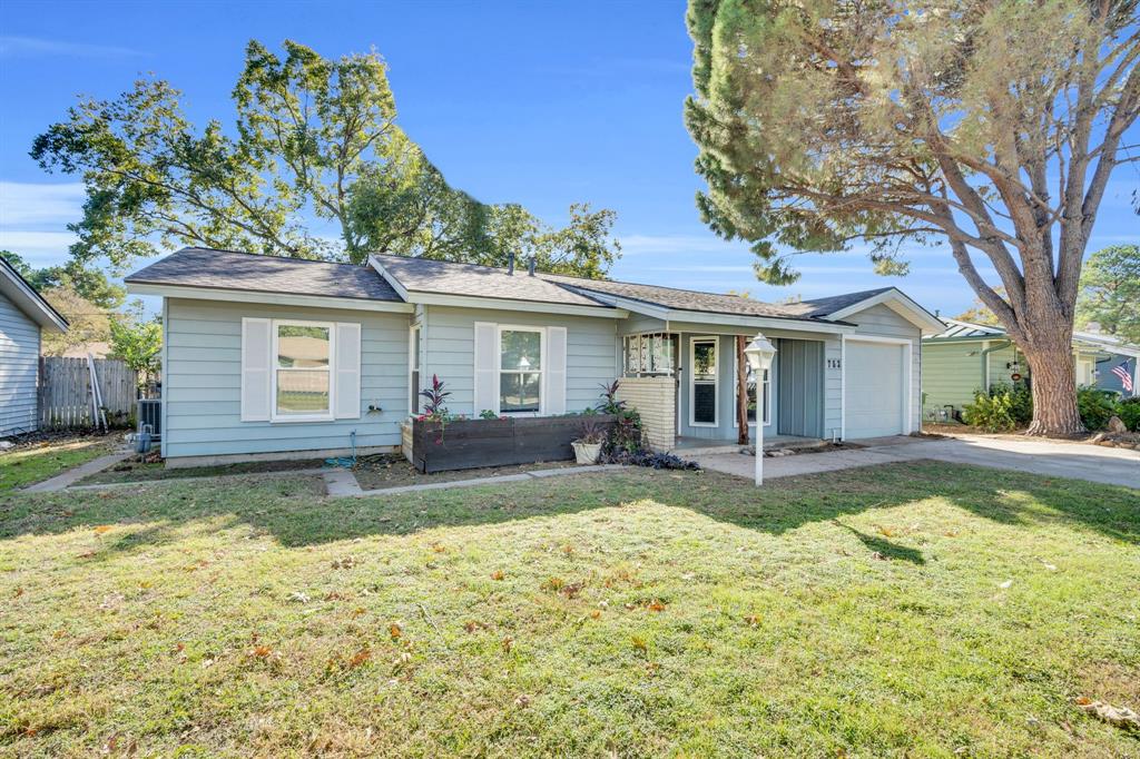 753 Cullum Avenue Hurst, TX 76053 - Photo 3 of 26 a view of a house with swimming pool and a yard