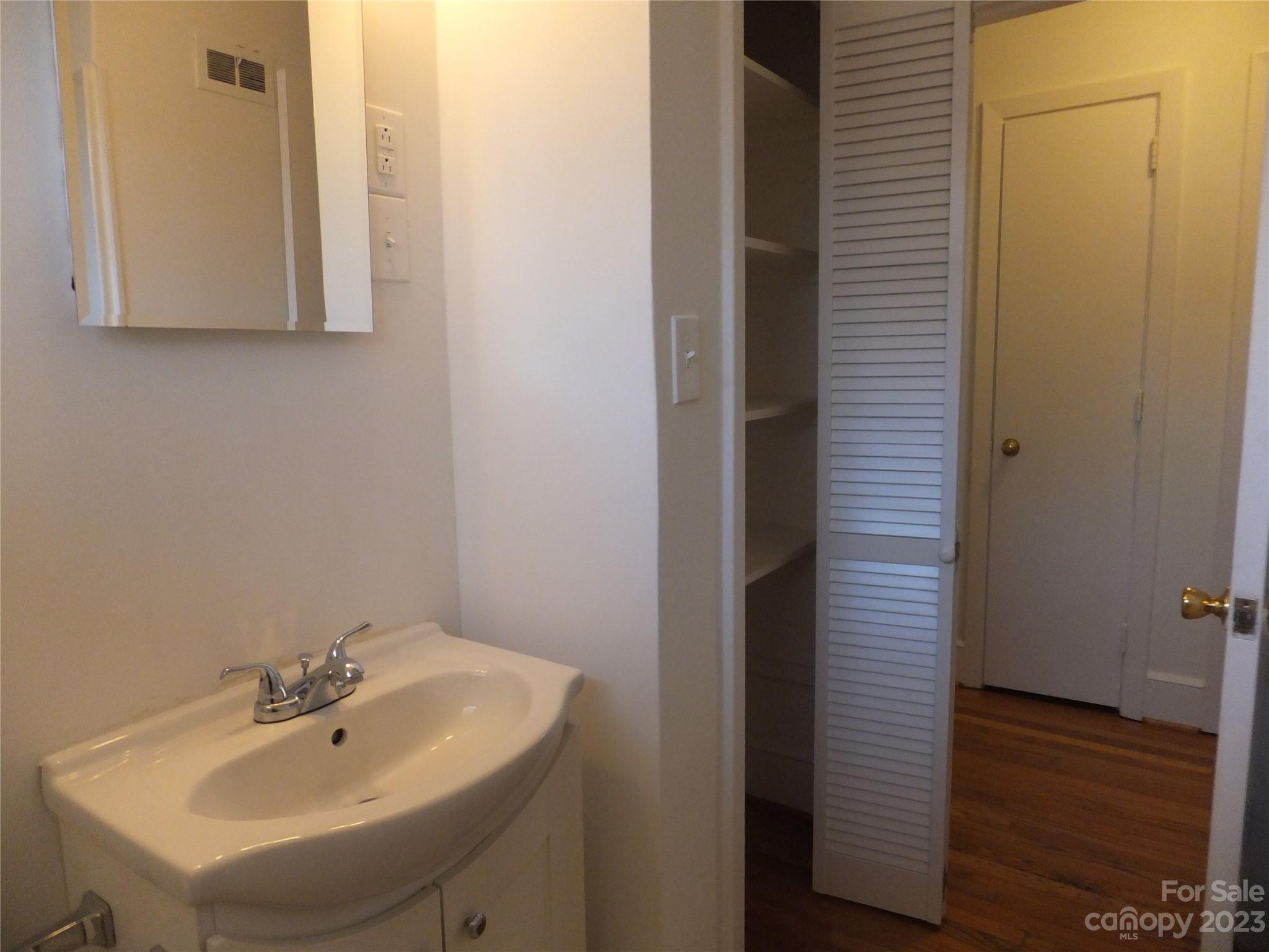 4222 Randolph Road Charlotte, NC 28211 - Photo 15 of 18 a bathroom with a sink and a mirror