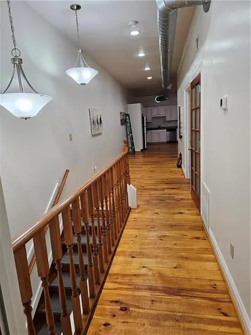 a view of a livingroom with wooden floor