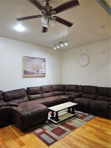 a living room with furniture and a rug