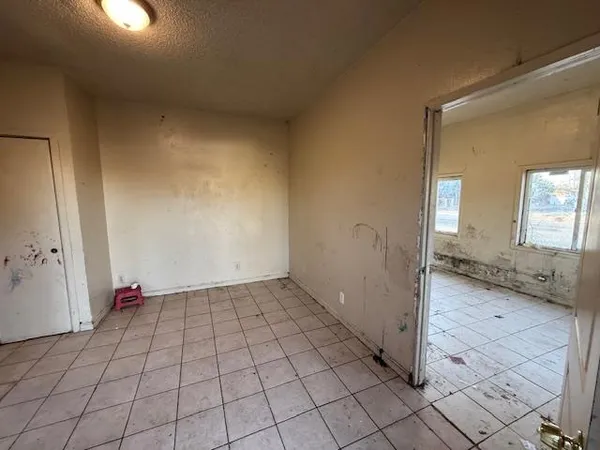 a view of an empty room and window