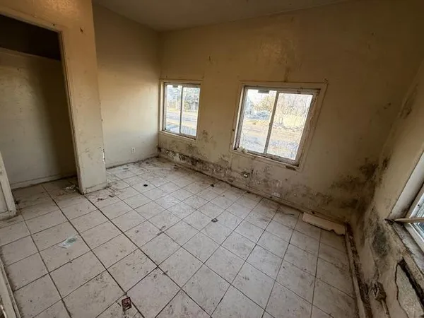 a view of an empty room and window