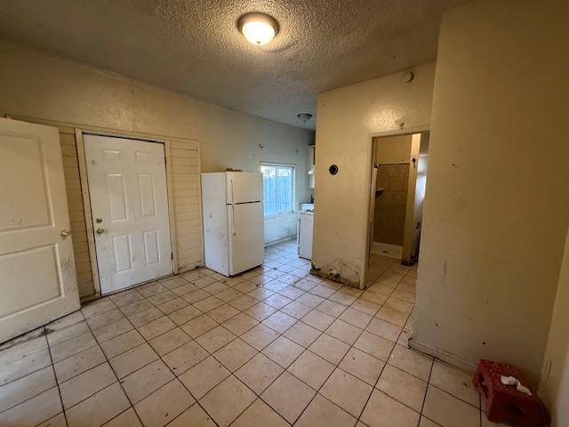 401 Thrasher Avenue Modesto, CA 95354 - Photo 10 of 12 a view of a refrigerator and more cabinets