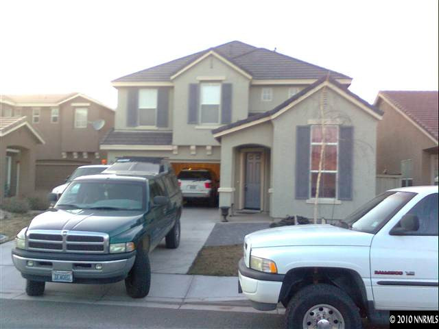 9365 Hummer Court Reno, NV 89521 - Photo 1 of 1 a front view of a house with parking space