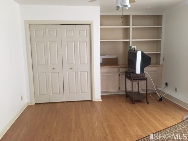 22 Shawnee Avenue San Francisco, CA 94112 - Photo 15 of 21 a view of a workspace with furniture and wooden floor
