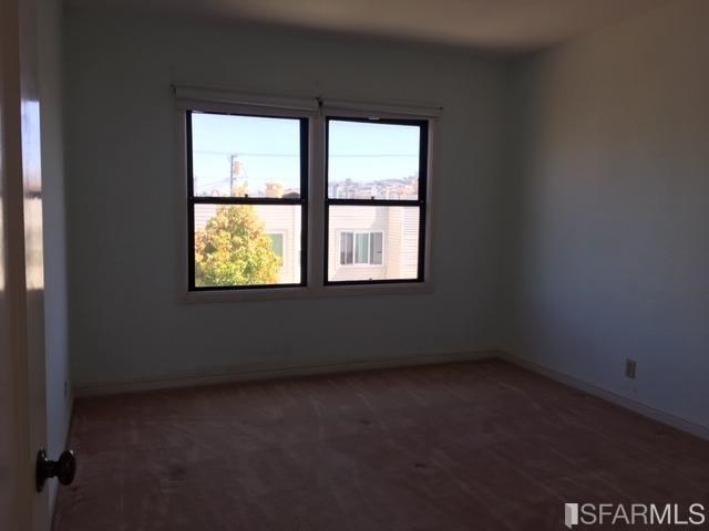 22 Shawnee Avenue San Francisco, CA 94112 - Photo 17 of 21 an empty room with a window