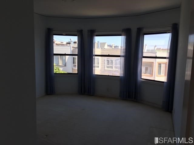 22 Shawnee Avenue San Francisco, CA 94112 - Photo 4 of 21 a view of an empty room with a window
