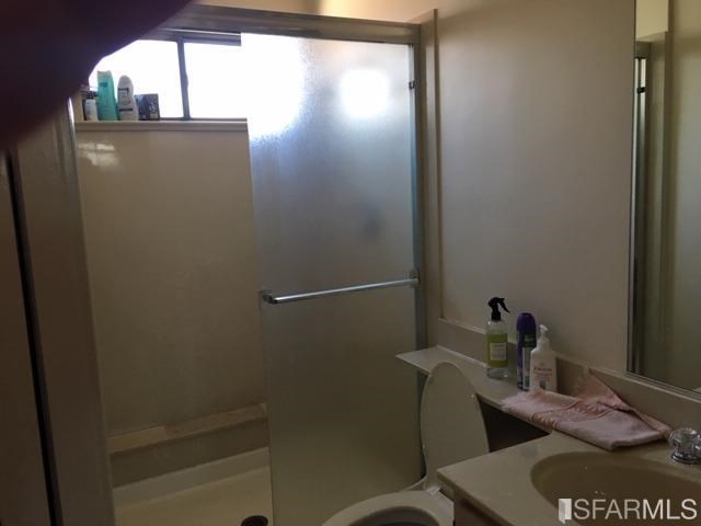 22 Shawnee Avenue San Francisco, CA 94112 - Photo 8 of 21 a bathroom with a sink and mirror