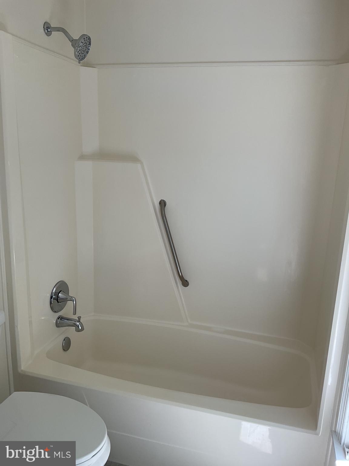 2001 Powder Horn Drive Fort Washington, MD 20744 - Photo 20 of 26 a bathroom with a shower and a toilet