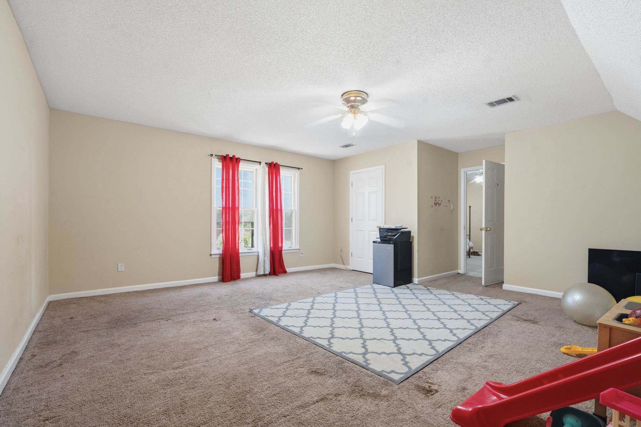 7105 Cutter Mill Road Memphis, TN 38141 - Photo 21 of 23 Living area with a ceiling fan and light carpet