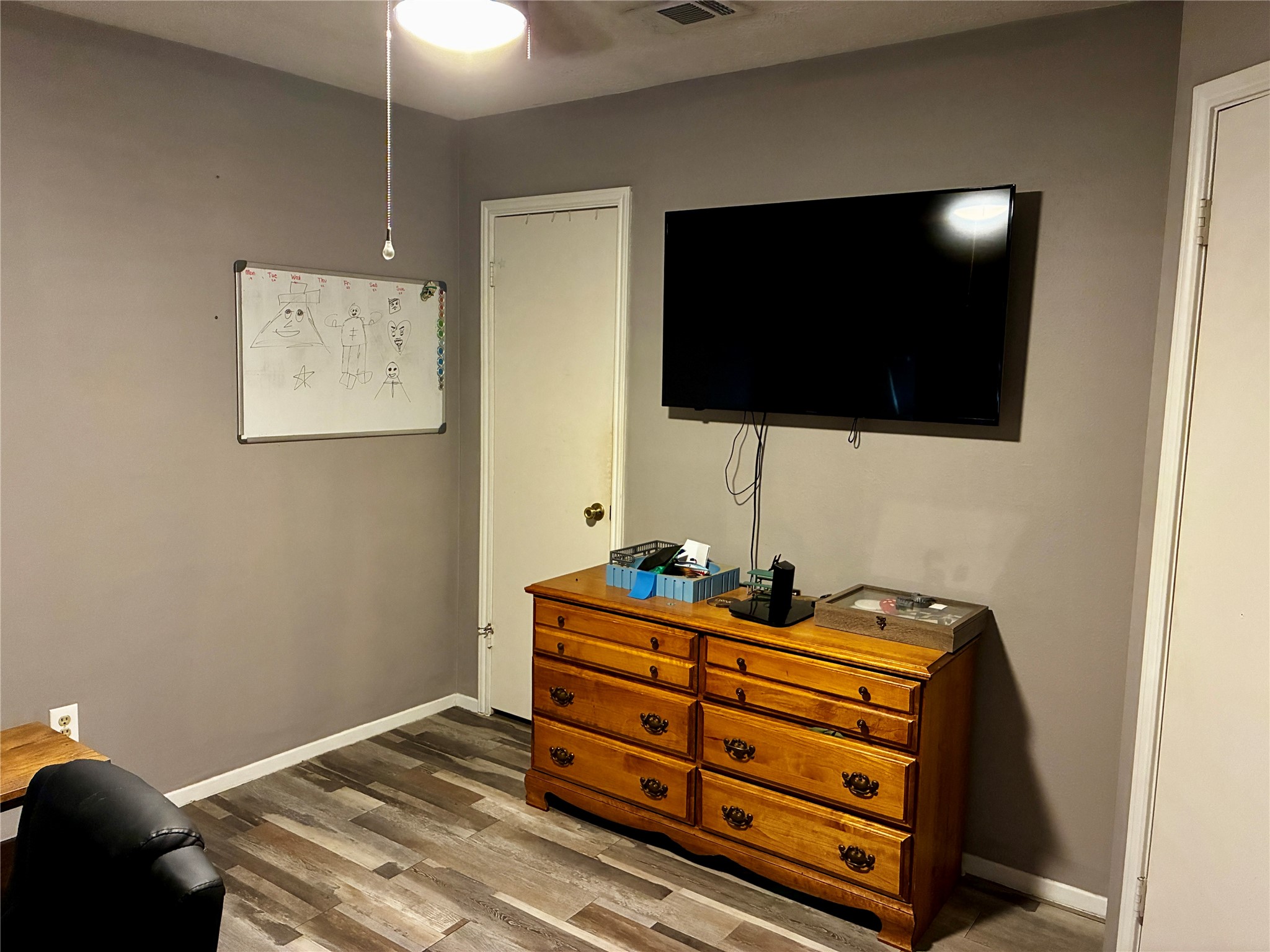 2 Sarita Road Angleton, TX 77515 - Photo 15 of 21 a bedroom with a bed and flat screen tv