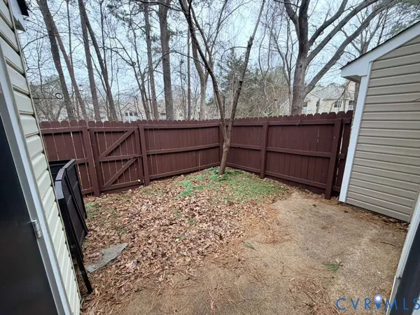 a view of a backyard of the house
