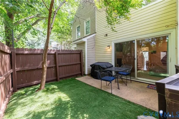 a view of a backyard with furniture and a backyard